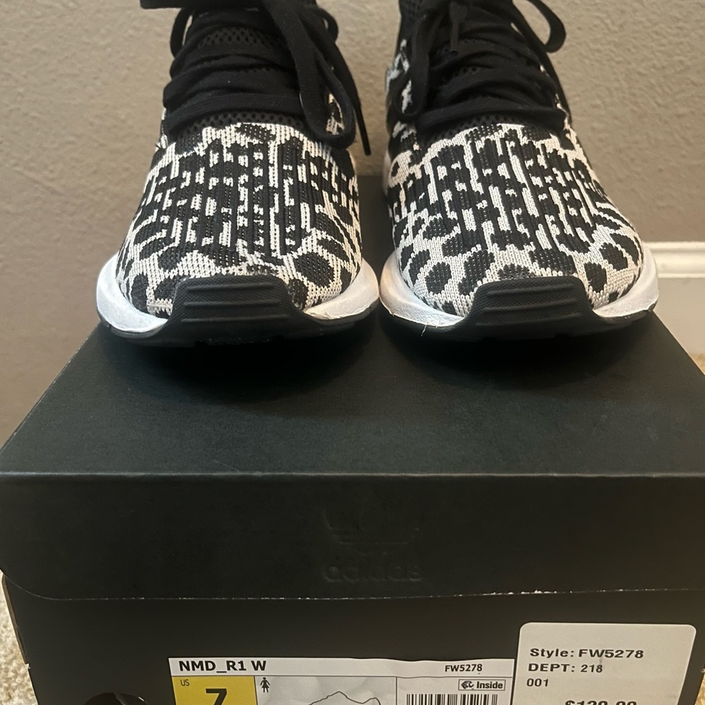 Adidas black and white sneaker worn in very good condition.